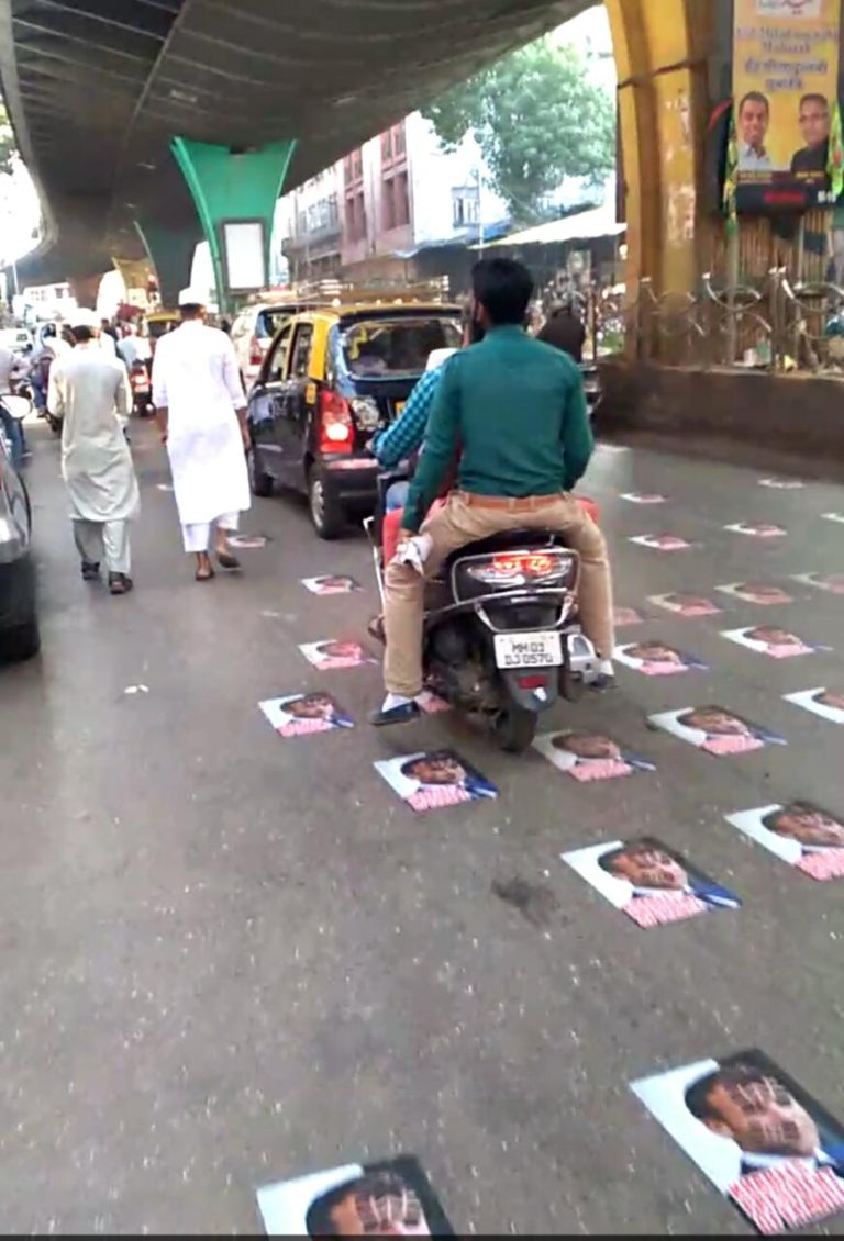 Mumbai Muslims protested against French Prez Emmanuel Macron’s anti-Muslim speech,walked on his poster plastered on Mohammad Ali  road in south Mumbai